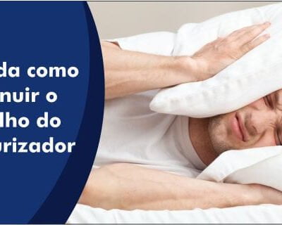Foto demonstrativa de uma pessoa com um travesseiro na cabeça tentando dormir, mas por causa do ruído do pressurizador não consegue.